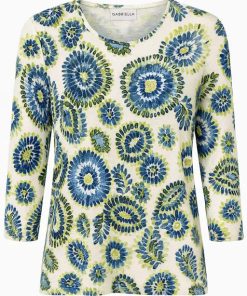 Marinello dames shirt met driekwart mouwen en blauw-groene cirkelvormige bloemenprint op witte achtergrond.