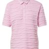 Lichtroze Rabe dames poloshirt met korte mouwen en horizontale plissé-structuur.