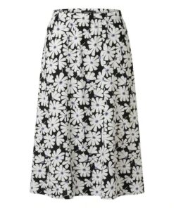 Donkerblauwe Marinello rok met grote witte bloemenprint, een A-lijn model en een elastische tailleband op een witte achtergrond.