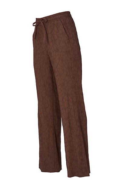 Bruine Dreamstar broek model Linko met wijde pijpen, elastische tailleband en subtiele geborduurde bloemenpatronen.