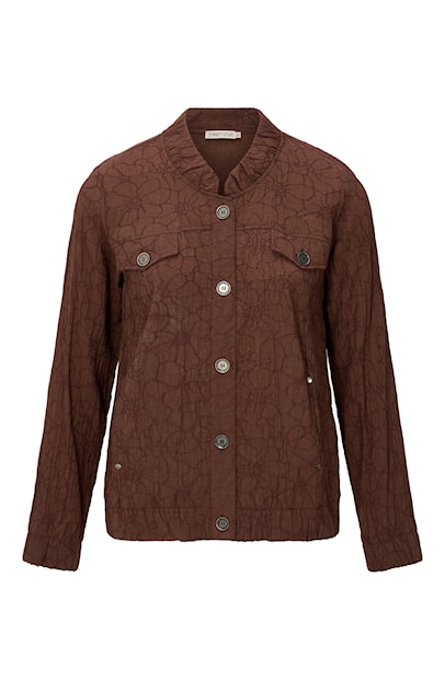 Bruin Dreamstar jasje Dokuma met knoopsluiting, borstzakken en een subtiel geborduurd bloemendessin op een witte achtergrond.